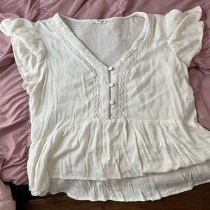 Beige top. High to low fitting. Thin material perfect for warm weather